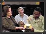 Brenda gives Wayne Brady an edible emmy award.