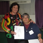 Brenda & Phil Ortiz at BEA 2009 - I enjoyed getting “Simpsonized” by Phil Ortiz, the original. Simpson's artist.